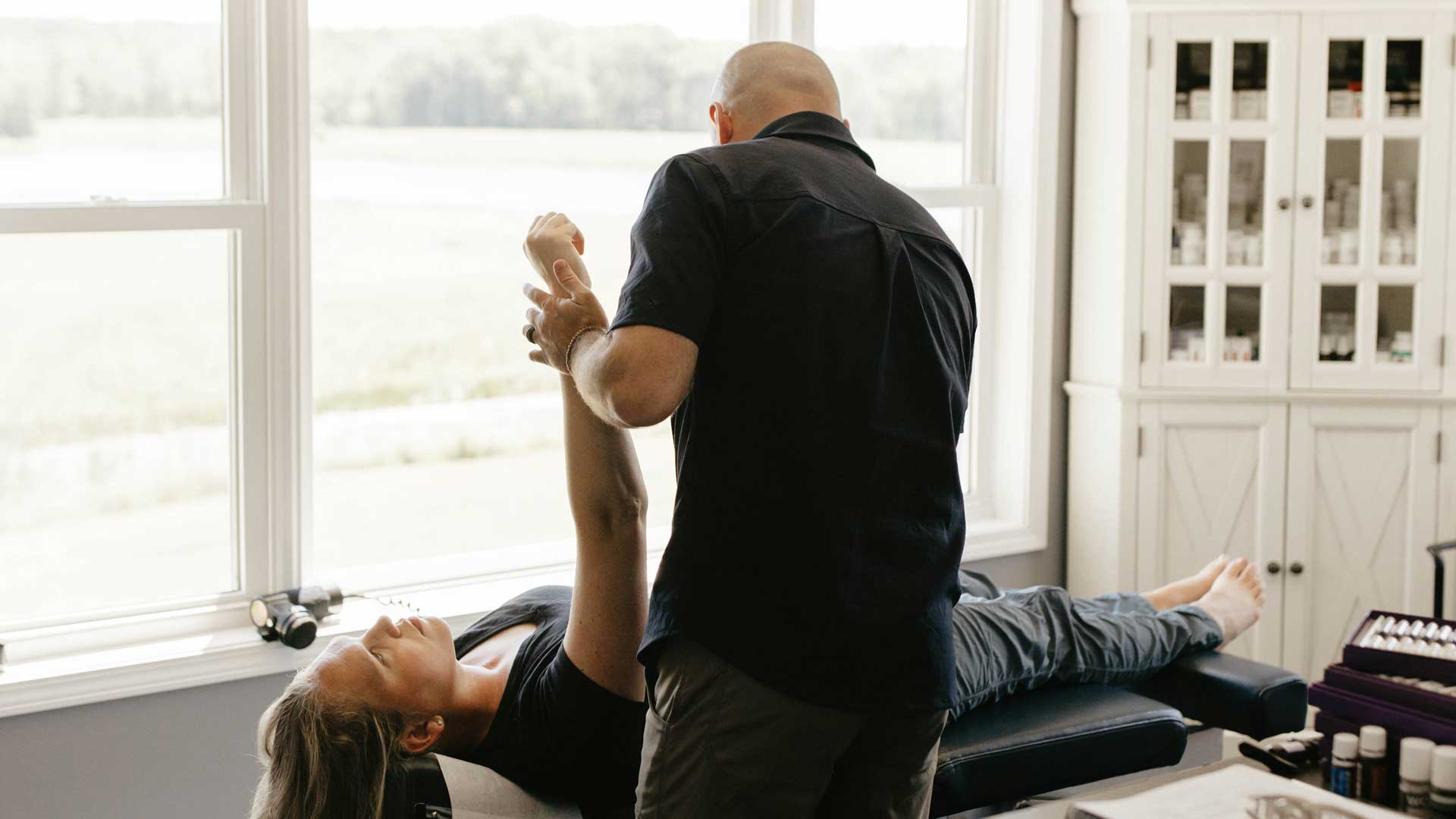 Diagnostic Manual Muscle Testing of the Arm Dr. Dylan Miller applying controlled resistance during a manual muscle test of a patient's arm.