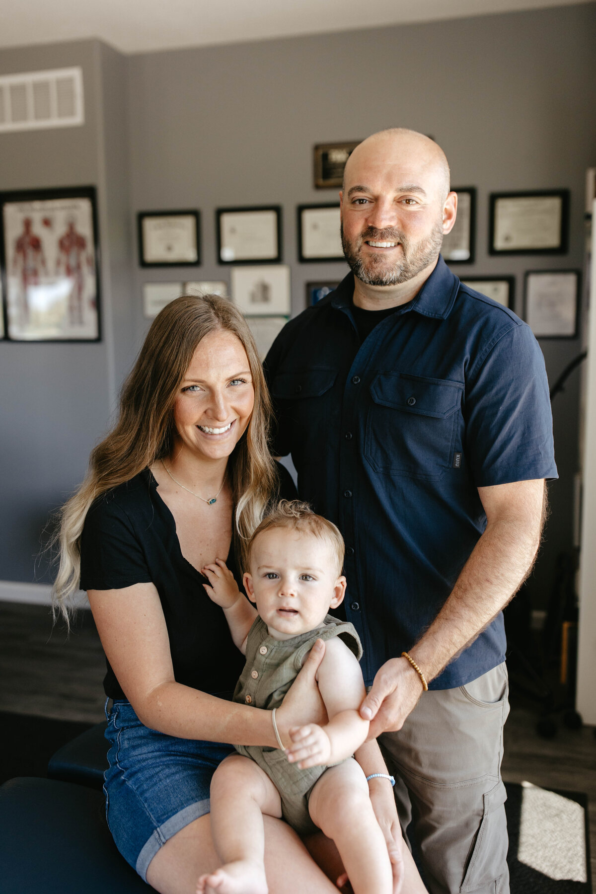 Dr. Dylan Miller and Chelsea Miller with their child